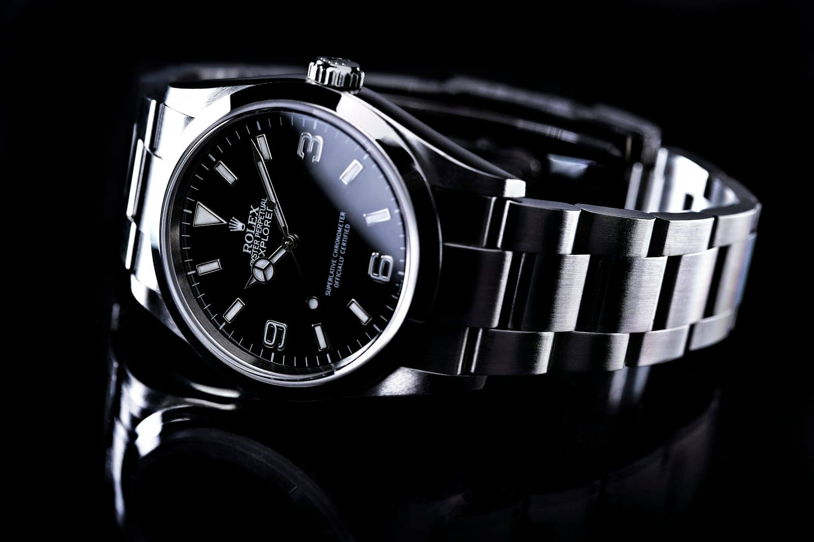 Watchmaker hands adjusting a mechanical timepiece