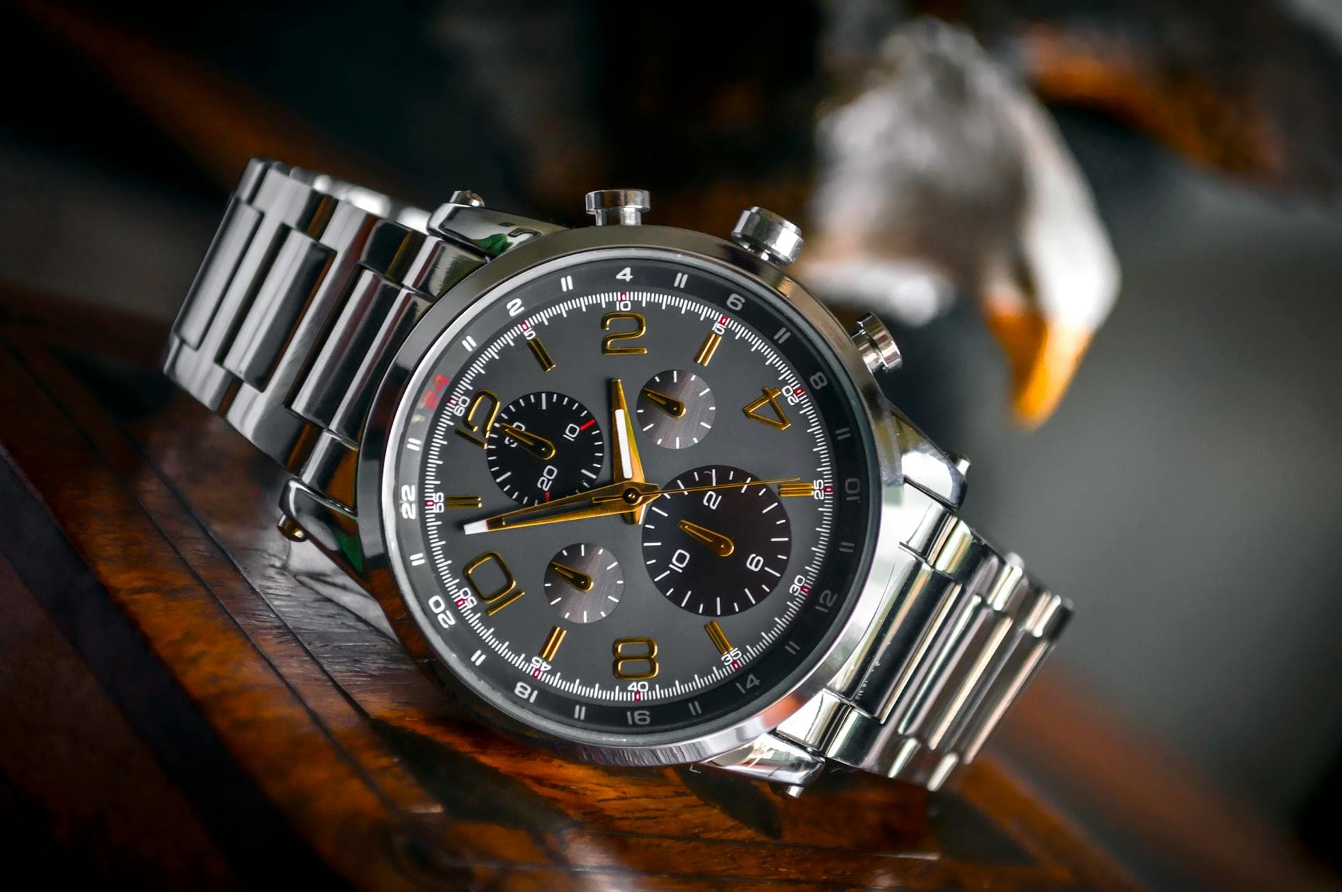 Luxury mechanical wristwatch on a dark surface