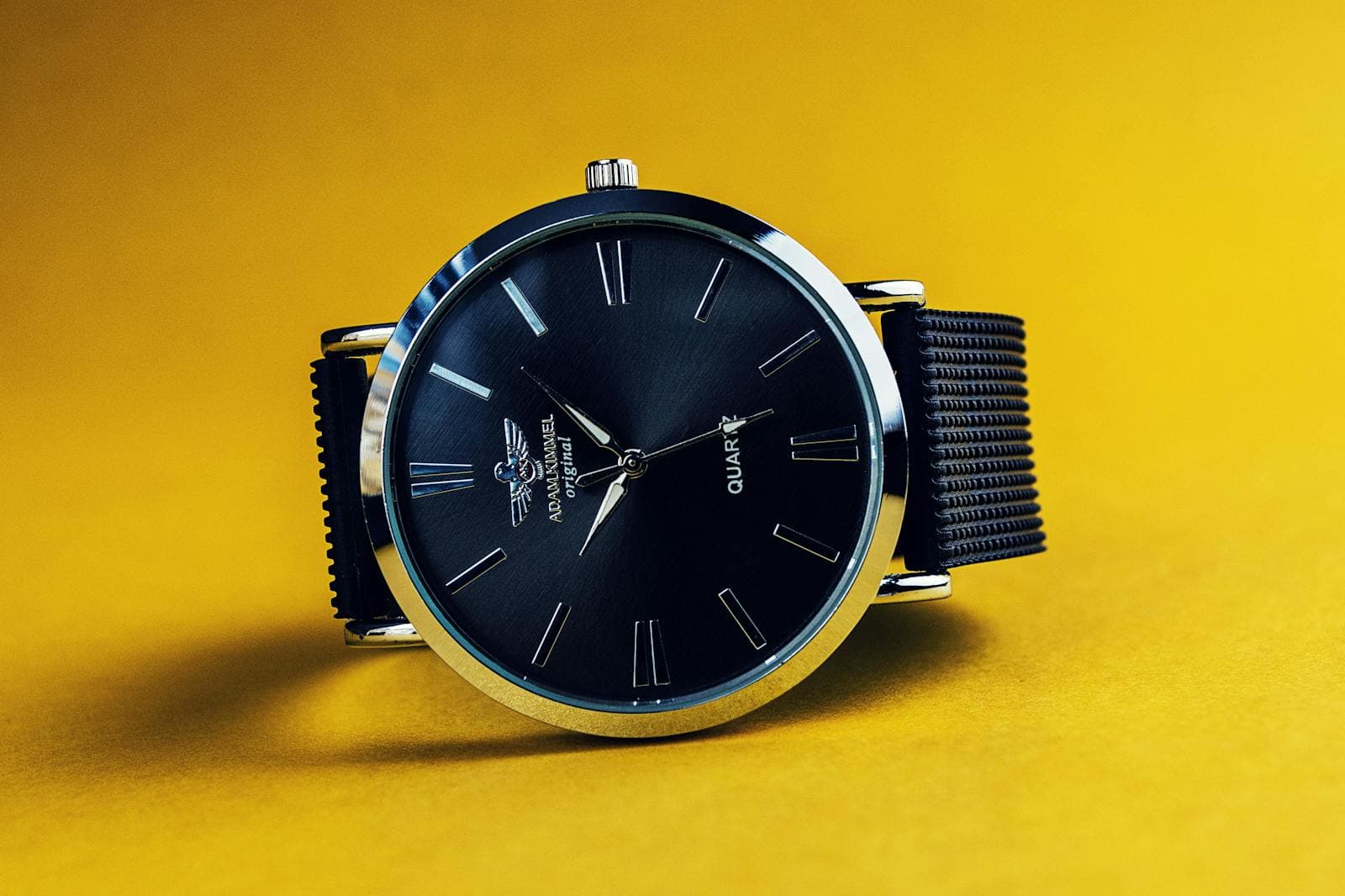 Luxury wristwatch with leather strap in warm light